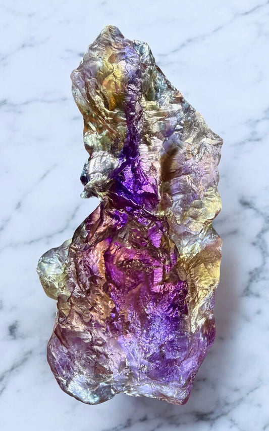 A-grade Bolivian ametrine specimen, 303 grams, showing natural etched quartz surfaces and deep color contrast
