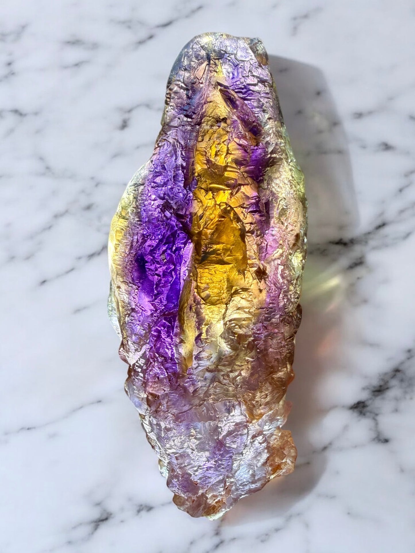Natural hydrothermal etched ametrine specimen displaying strong internal zoning and preserved quartz crystal surfaces