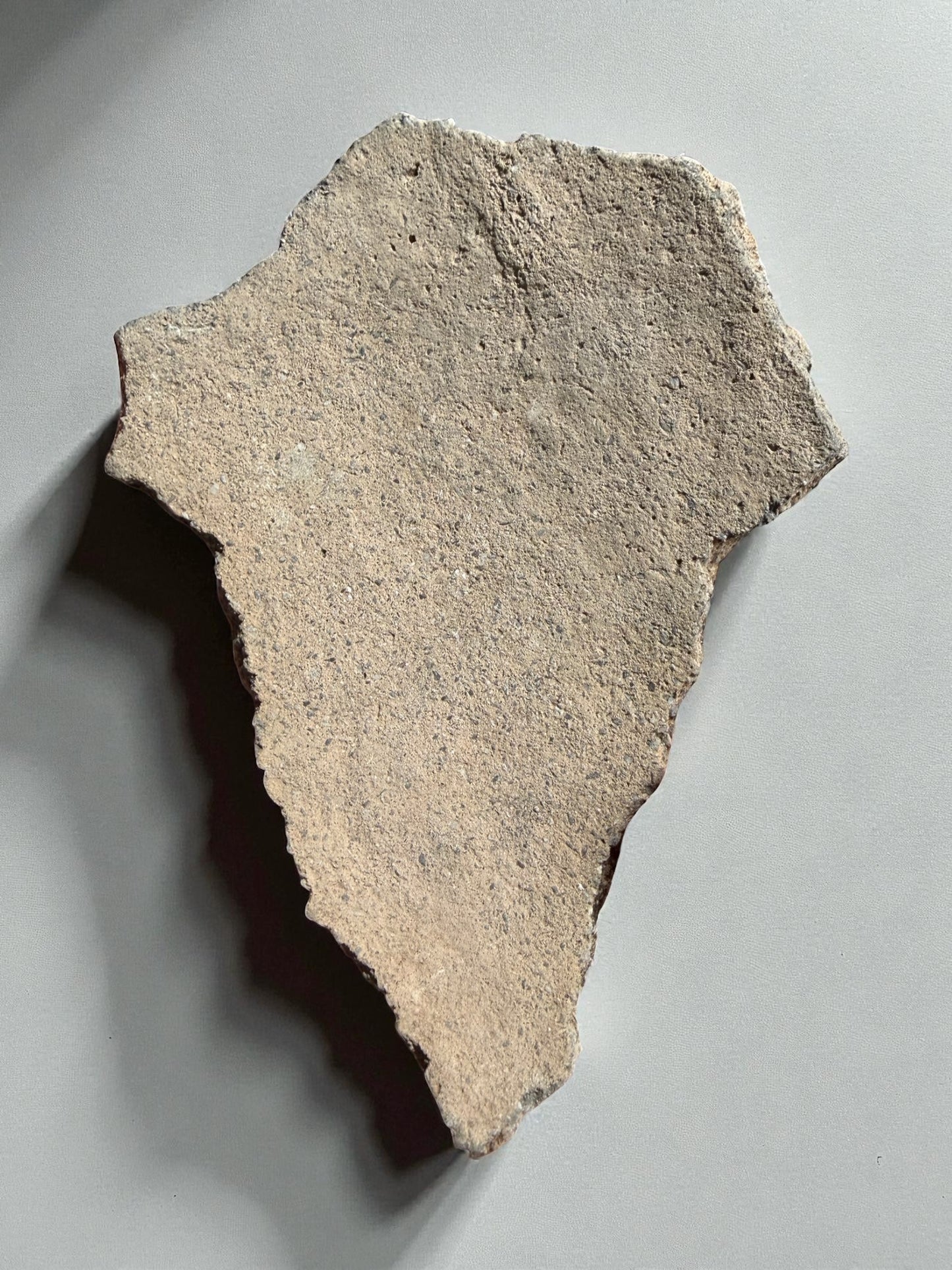 Historic Hohokam ceramic piece, archaeological pottery shard
Ancient pottery fragment with red-brown surface, Arizona artifact