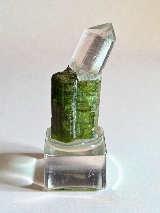 Green tourmaline with angled quartz crystal from Aricanga Mine, Tunnel 2, mounted on clear base